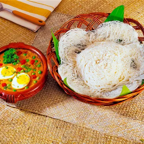 traditional idiyappam with egg roast breakfast in kochi's best homestay